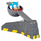 A toy catapult with a plastic balled-up Sonic the Hedgehog figure inside.